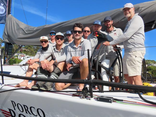 The Porco Ross crew, skippered by Paul McCartney (holding wheel) are vying for line honours in the Launceston to Hobart Yacht Race. Picture: Jon Tuxworth