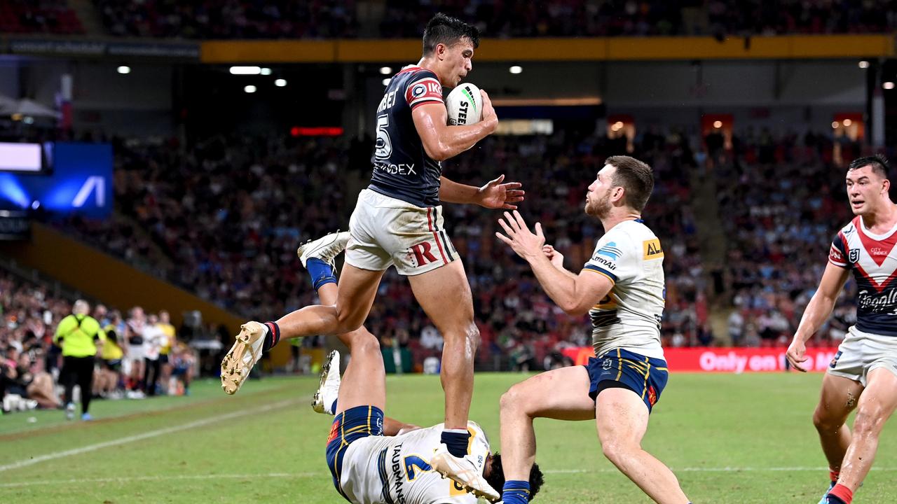 BRISBANE, AUSTRALIA - MAY 15: Joseph Suaalii of the Roosters takes a catch before dicing over to score a try during the round 10 NRL match between the Sydney Roosters and the Parramatta Eels at Suncorp Stadium, on May 15, 2022, in Brisbane, Australia. (Photo by Bradley Kanaris/Getty Images)