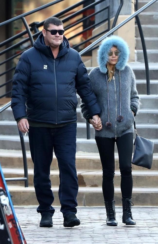 Australian billionaire James Packer holds hands with his new girl as they hit the town with friends during the day in Aspen. Picture: Backgrid Australia