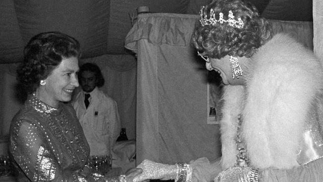 Queen Elizabeth II meets Dame Edna Everage at Windsor in 1977. Picture: Getty Images