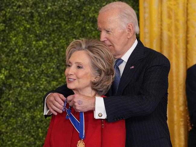 Hillary Clinton receives the Medal of Freedom from United States President Joe Biden during a ceremony at the White House in Washington, DC, January 4, 2025. (Photo by Chris Kleponis / AFP)