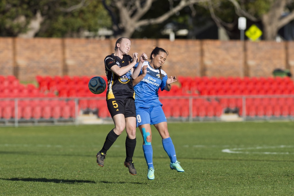 Cherie Thompson (left) of Mudgeeraba Soccer Club and Jess Fry of South West Queensland Thunder in NPL Queensland women round 24 football at Clive Berghofer Stadium, Saturday, August 11, 2018. Picture: Kevin Farmer