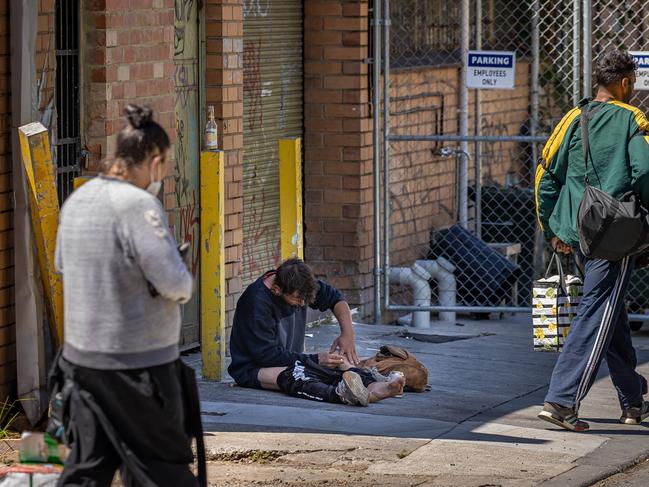 A man openly injects drugs in North Richmond near the injecting room. Picture: Jason Edwards