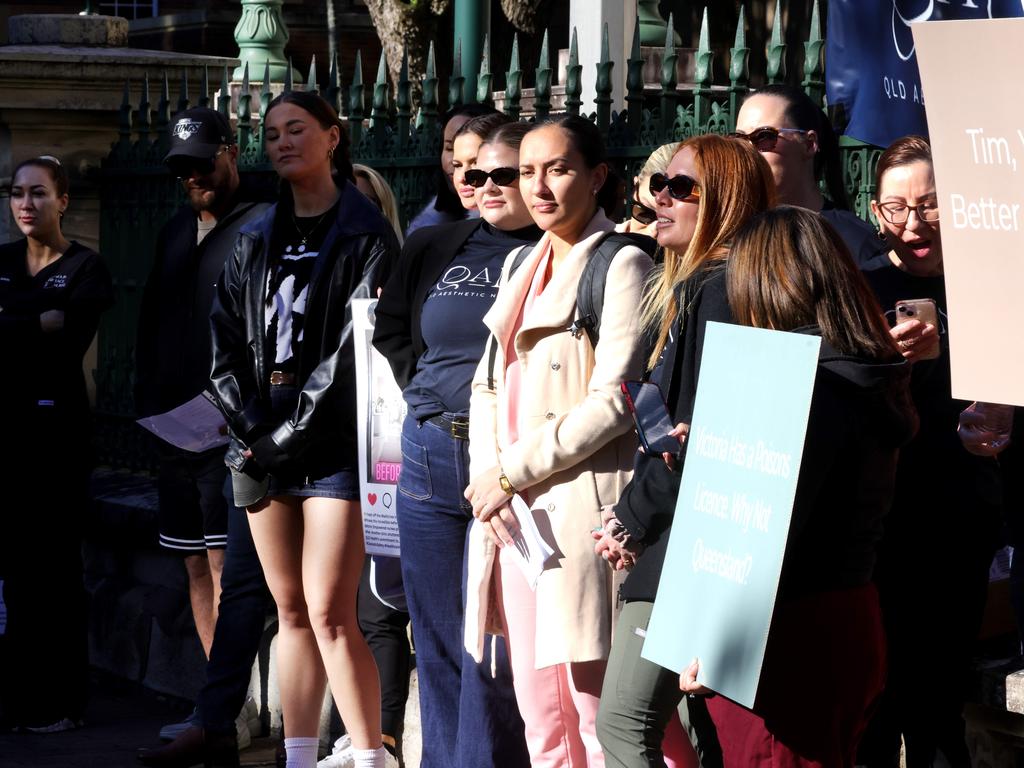 Protesters, including nurses in uniform, attending a cosmetic rally at outside Parliament House. Photo Steve Pohlner