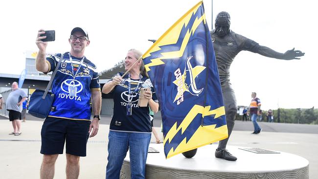 Cowboys fans pose with the Johnathan Thurston statue outside the new Queensland Country Bank Stadium before the start of the opening-round match against Brisbane. Picture: Getty Images