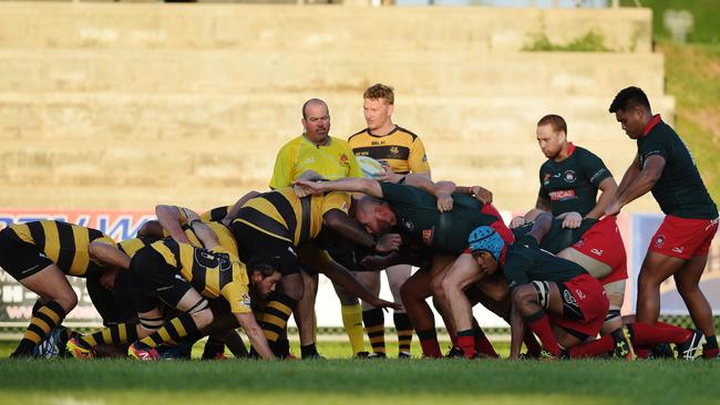 South Darwin Rabbitohs and Darwin Dragons engage into a scrum during Round 9 of the NTRU. Picture: Keri Megelus