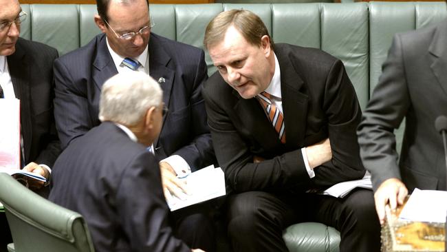 Future Fund founders, Peter Costello and John Howard talk in the House of Representatives during question time.