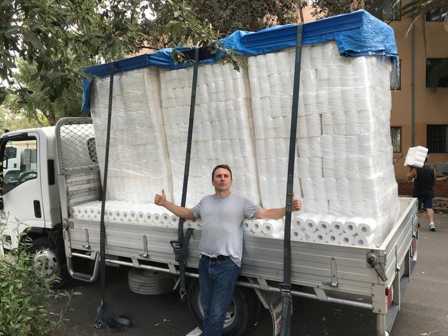 Richard Buttrose with a truckload of toilet paper.