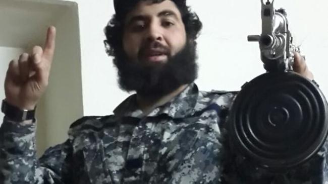 Sydney man Ahmed Merhi, armed with an assault rifle. Police believe he left Australia to fight in Syria.