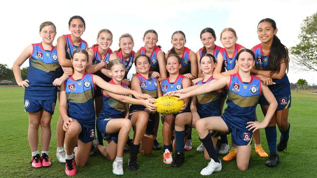 Ryan Primary Girls AFL Team are attending the State Titles in Maroochydore. (Back row L-R) Elliot Edwards, Milla Creenaune, Millie Huggett, Abbey Guy, Phoebe Gordy, Lexie Bloxsom, Isabelle Need, Alliyah Suckling, Aura Solomona, (front row L-R) Chelsea Drummond, Georgia Chapman, Felicity Doll, Sienna Hirvonen, Willow Wilesmith and Khaleesi Wilesmith, (Absent) Finella Keir and Reese Achilles. Picture: Shae Beplate.