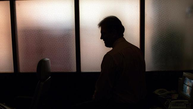 Generic image. Silhouette of a man (parent of) a sex abuse victim in an office. wrongly accused of touching young girl. Child sexual abuse. sex crime incest paedophilia.