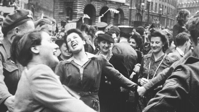 07/05/1945. Women join hands to celebrate VE Day marking end of World War two (II) in Europe in streets of London. England. WWII. 1945.