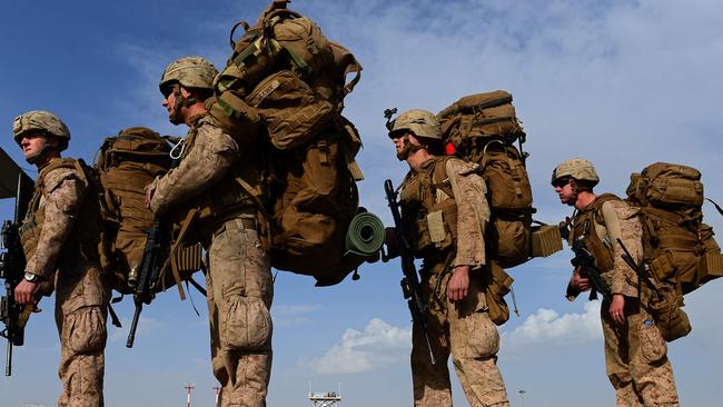 US Marines board a C-130J Super Hercules transport aircraft headed to Kandahar. Picture: AFP