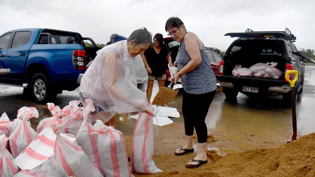 Donna Young and Susan Trowse fill sandbags at Lou Lister Park on Saturday. Picture: Evan Morgan