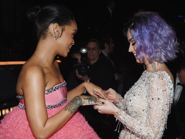 Pop princesses ... Rihanna and Katy Perry compare manicures. Picture: Larry Busacca/Getty Images for NARAS