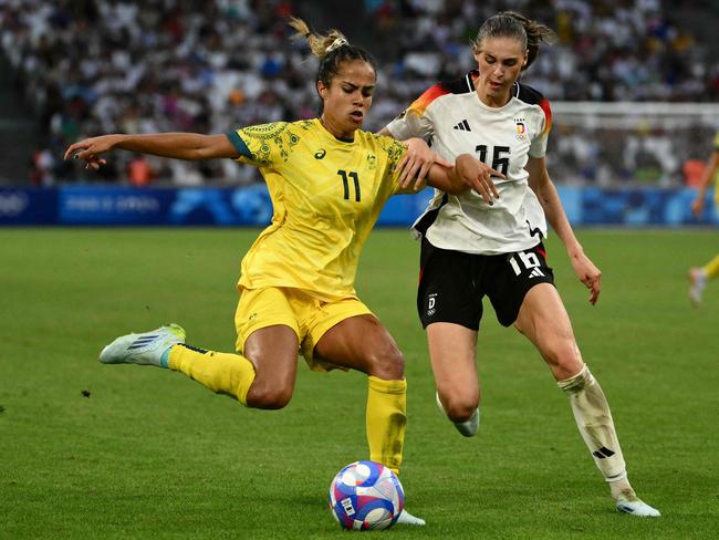 Fowler against Germany’s Jule Brand during the Olympics. Photo by Christophe SIMON / AFP