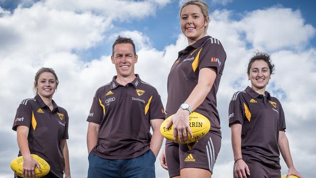 Hawthorn coach Alastair Clarkson with prospective Box Hill players Ebony Nixon, Bronte Bilston-Gorley and Adriana Piva. Picture: Jake Nowakowski