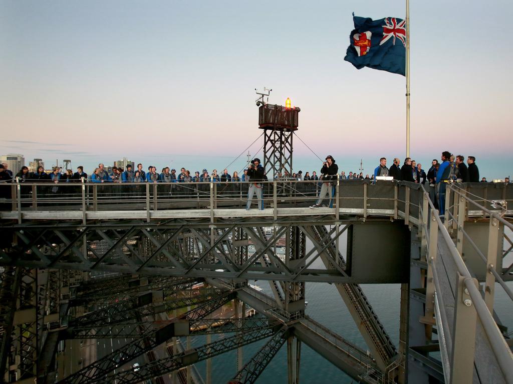 A dawn service was held on the summit of the Sydney Harbour Bridge to commemorate ANZAC Day. Money raised by the members of the public who climbed the bridge went to RSL DefenceCare. NRL CEO Todd Greenberg and former Parramatta Eels player Nathan Hindmarsh were some of those in attendance. Picture: Toby Zerna