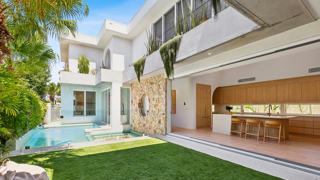 The stunning pool area and kitchen