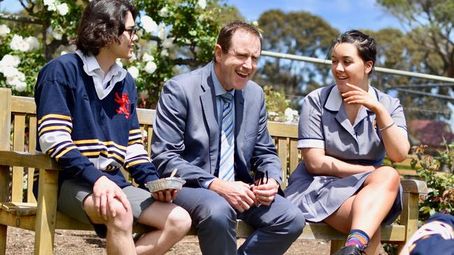 Scotch College Adelaide principal John Newton with students Ris Mosel and Amelia Waters.