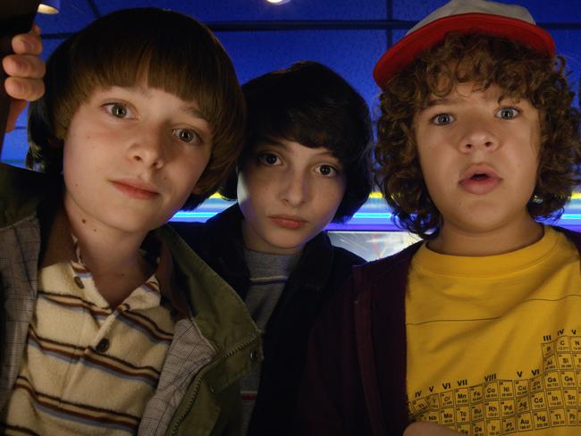 This image released by Netflix shows Noah Schnapp, from left, Finn Wolfhard, Gaten Matarazzo and Caleb Mclaughlin in a scene from "Stranger Things," premiering its second season on Friday. (Netflix via AP)