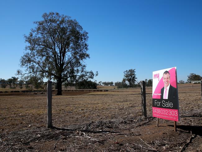 For Sale signs dot the road in Cawdor where the planned route will run through existing properties. Picture: Toby Zerna