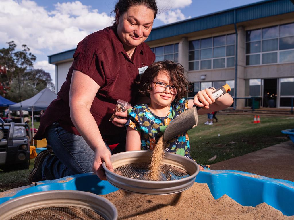 Chloe Clark and daughter Imogen Clark fossicking at Gemfest hosted by Toowoomba Lapidary Club at Centenary Heights State High School, Saturday, October 19, 2024. Picture: Kevin Farmer