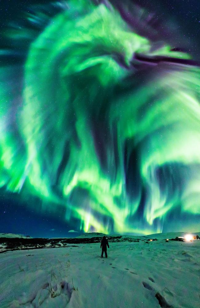 The stunning photograph reveals a huge dragon rearing its head in the sky over Iceland earlier this month. Picture: Jingyi Zhang &amp; Wang Zheng/NASA