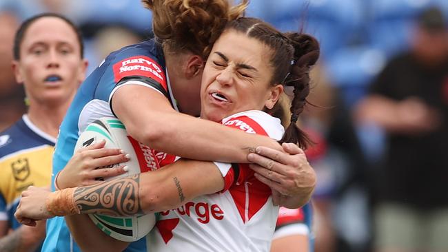 NEWCASTLE, AUSTRALIA - FEBRUARY 27: Madison Bartlett of the Dragons is tackled during the round one NRLW match between the St George Illawarra Dragons and the Gold Coast Titans at McDonald Jones Stadium, on February 27, 2022, in Newcastle, Australia. (Photo by Ashley Feder/Getty Images)