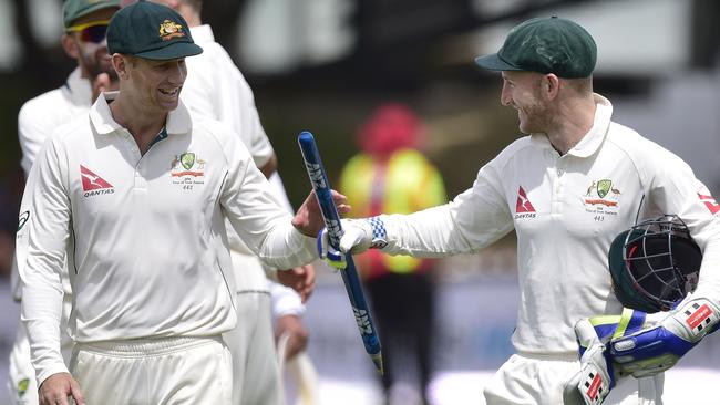 Peter Nevill hands Adam Voges a well-earned keepsake following Australia’s win in the first Test.
