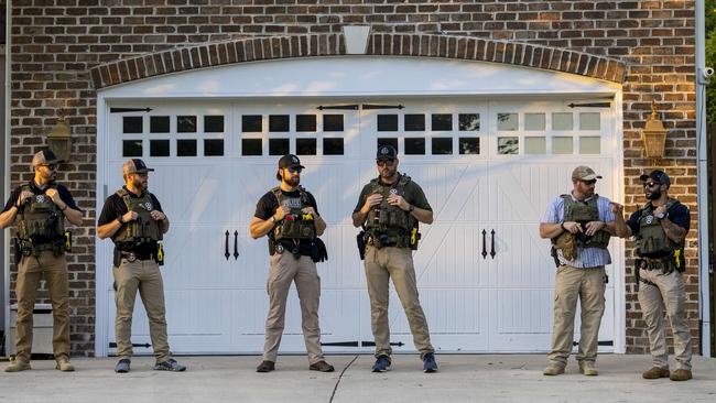 US Marshals stand guard as abortion rights protesters demonstrate outside Supreme Court Justice Samuel Alito's home in Alexandria, Virginia. Picture: AFP