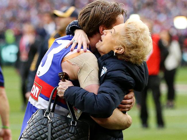 Western Bulldogs Jordan Roughead embraces Susan Alberti after the siren 2016 AFL Grand Final match between the Western Bulldogs and the Sydney Swans at the Melbourne Cricket Ground (MCG), Melbourne, Australia on October 1, 2016. Picture: Mark Stewart