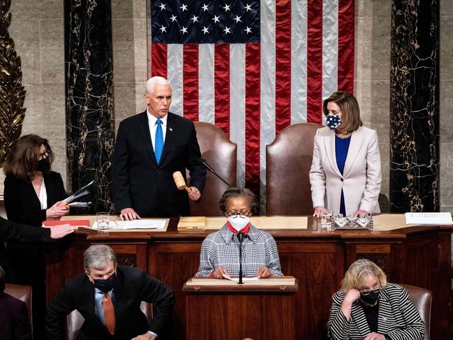 Vice President Mike Pence and House Speaker Nancy Pelosi preside over a Joint session of Congress to certify the 2020 Electoral College results after the Capitol riot. Picture: Erin Schaff/AFP