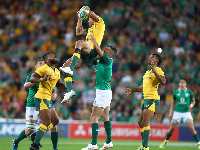 Israel Folau climbs high to claim a catch against Ireland. Picture: Getty Images