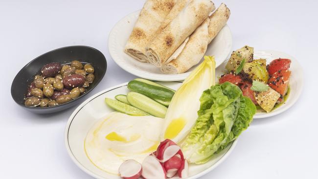 Fresh and lively: flatbread, tomatoes with olive, almond “hummus” with fresh vegetables. Picture:Rob Leeson.