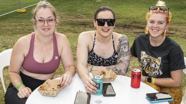 (from left) Jess Reynolds, Sam Thomasson and Remi Cowan at Meatstock, Toowoomba Showgrounds. Saturday, April 9, 2022. Picture: Nev Madsen.