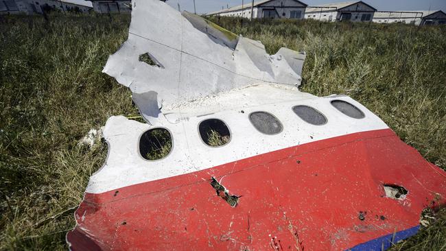 A piece of debris of the fuselage at the crash site of the Malaysia Airlines Flight MH17 near the village of Hrabove (Grabovo), some 80km east of Donetsk, on July 25, 2014. Picture: AFP