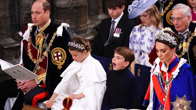 It was a big day for five-year-old Louis was a little distracted. Picture: Yui Mok / POOL / AFP