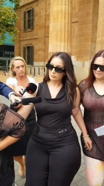 Jacinta Davila tries to avoid media outside court