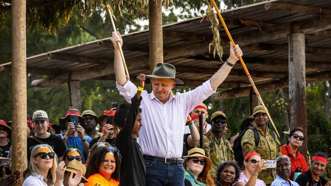 Anthony Albanese receives traditional gifts froma young Yolngu male during Garma Festival