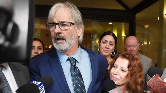 John Jarratt and wife Rosa Miano, right, leave court in Sydney on Friday. Picture: AAP