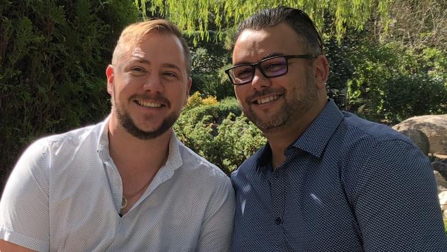 Correctional services officer Stewart Iain Berry, left, and his husband Mathew Campbell, right, on their wedding day. Both are charged with being part of HIV positive pedophile Jadd William Brooker's online child abuse ring. Picture: Supplied.