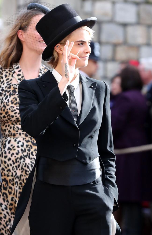 Cara Delevingne arrives to attend the wedding of Britain's Princess Eugenie of York to Jack Brooksbank at St George's Chapel, Windsor Castle, in Windsor, on October 12, 2018. (Photo by Gareth Fuller / POOL / AFP)