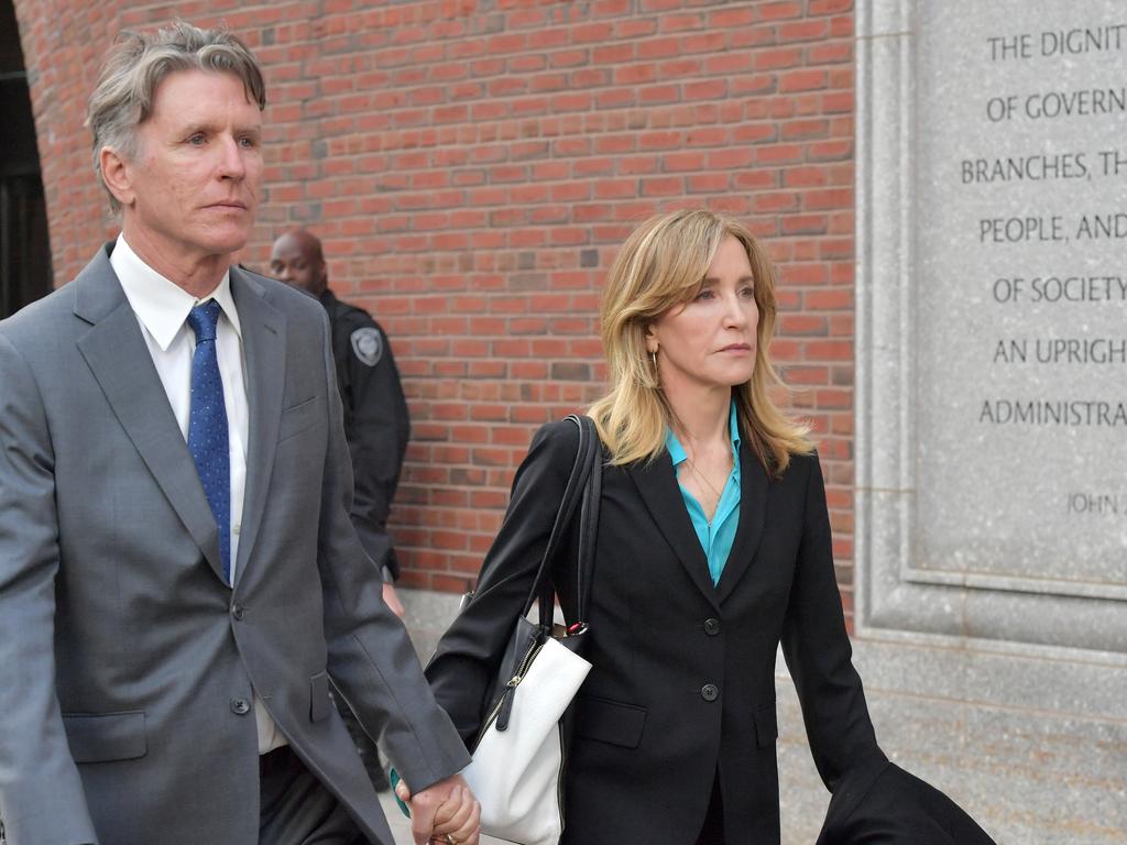 Felicity Huffman exits the court with her brother. Picture: Paul Marotta/Getty Images