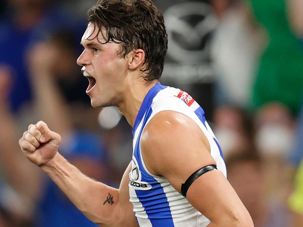 Curtis Taylor celebrates a goal during the Roos’ fightback. Picture: AFL Photos/Getty Images