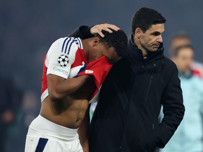 Jurrien Timber of Arsenal is consoled by Mikel Arteta after Arsenal’s defeat. Picture: AFP