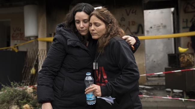 Amit Soussana, right, who was held hostage by Hamas, hugs a friend near her house where she was kidnapped during the Octobrt 7th attack in Kfar Aza, Israel. Picture: Getty