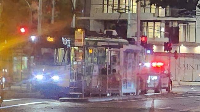 Police attended a tram after an elderly man was assaulted in St Kilda on Friday night.