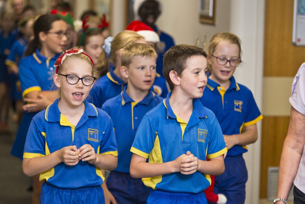 Leading the group are Lila Sullivan and Oscar Ghidella as Mater Dei Primary School Yr 4 students sing Christmas carols in the wards of St Vincent's Private Hospital, Friday, November 29, 2019. Picture: Kevin Farmer