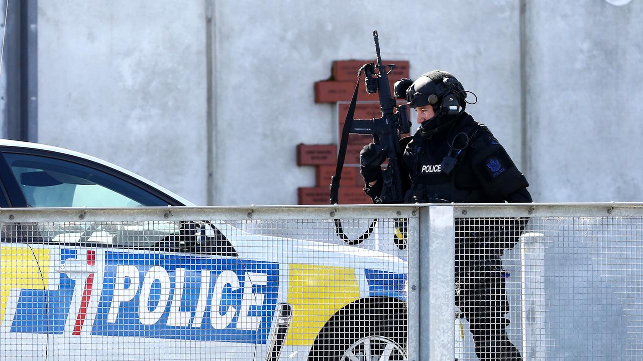 Armed offenders squad members and police monitor an incident at Forysth Bar. Picture: Dianne Manson